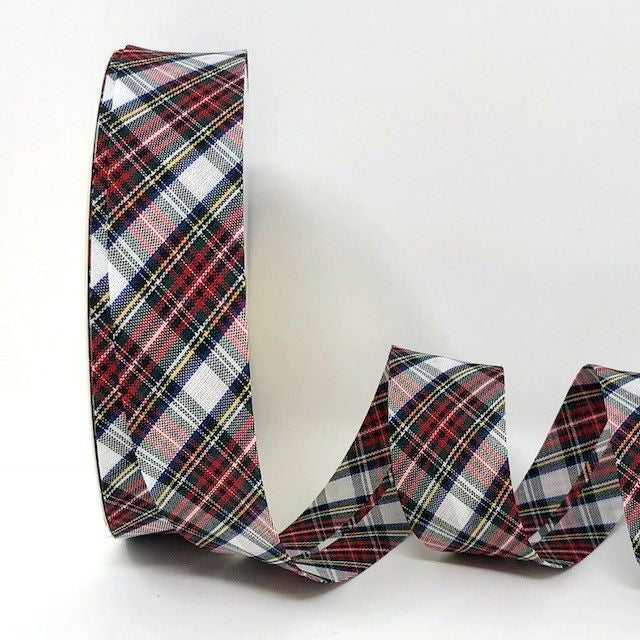 Plaid ribbon with red, blue, and white pattern on a white background