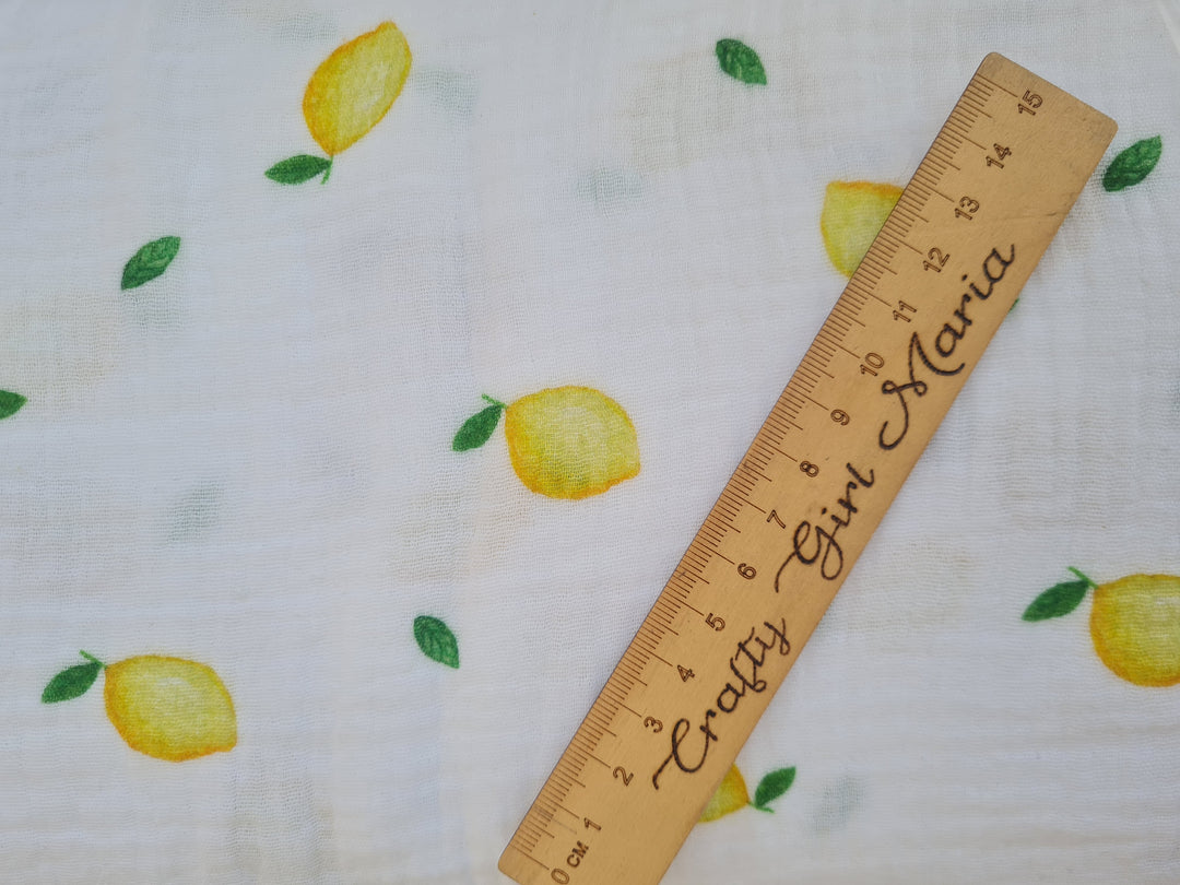 Lemons on white double gauze 100% cotton muslin fabric per 1/2m