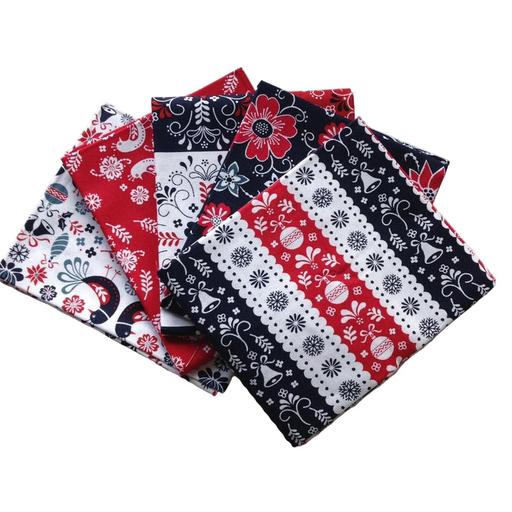 Scandi christmas fat quarters with red, white, and blue patterns on a white background