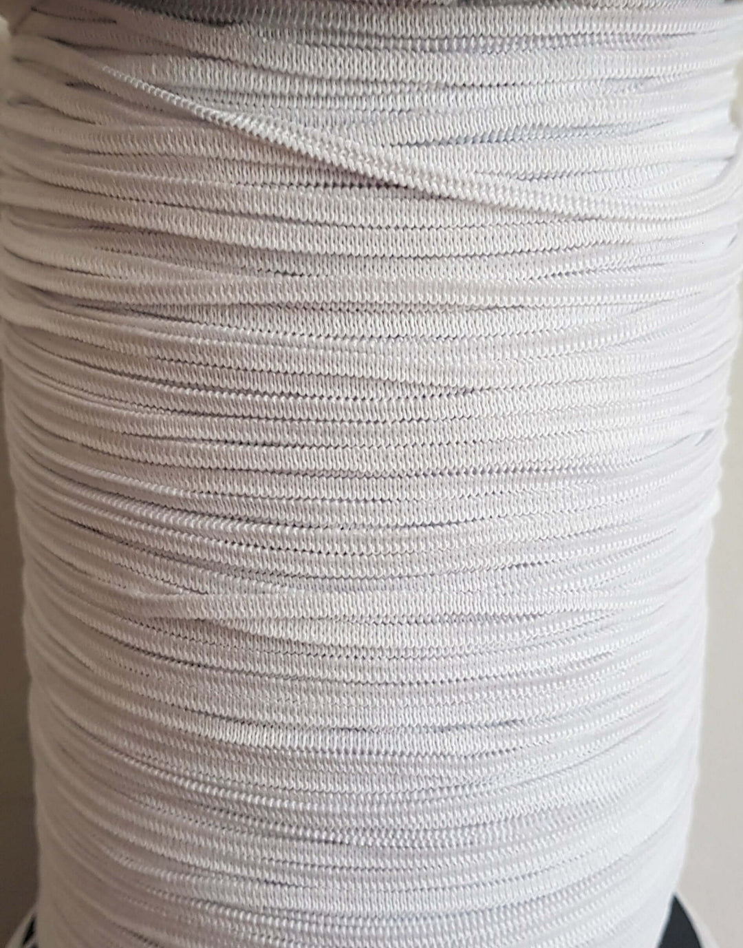 Flat braided elastic 3mm wide by the metre. White. Suitable for facemasks