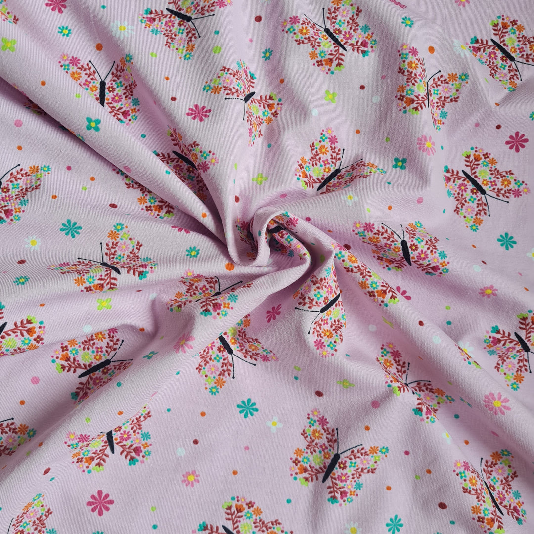 Tricot floral butterfly stretch cotton jersey knit fabric, by the half metre. Pink.